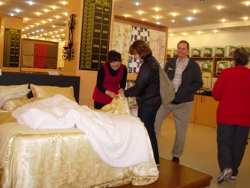 Jim and Janis buying a silk comforter  China 2010